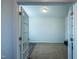 Cozy office space with carpeted floor, natural light, and french doors for privacy, ideal for remote work at 217 Windy Knoll Dr, Graham, NC 27253