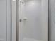 New bathroom features a shower with white tiles and a glass enclosure at 239 Faith Avenue, Sanford, NC 27330