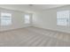 Bedroom with neutral carpet features three windows offering ample natural light at 239 Faith Avenue, Sanford, NC 27330