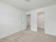 Neutral bedroom with carpet, showing closet with shelving and ensuite bathroom at 239 Faith Avenue, Sanford, NC 27330