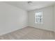 Bedroom features neutral carpet, white walls, and a window at 239 Faith Avenue, Sanford, NC 27330