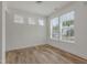 Well lit bedroom with three large windows and hardwood floors at 239 Faith Avenue, Sanford, NC 27330