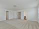 Spacious upper bonus room with neutral carpet, featuring multiple doorways and a window at 239 Faith Avenue, Sanford, NC 27330