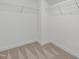 Walk-in closet featuring neutral carpeting and wire shelving for optimal storage at 239 Faith Avenue, Sanford, NC 27330