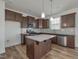 Spacious kitchen with stainless steel appliances and granite countertop island at 239 Faith Avenue, Sanford, NC 27330