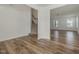Bright living room featuring hardwood floors and staircase access to the upper level at 239 Faith Avenue, Sanford, NC 27330