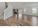 Open-concept living area with hardwood floors, recessed lighting, and access to the kitchen at 239 Faith Avenue, Sanford, NC 27330