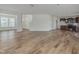 Expansive living area with hardwood floors, seamlessly connecting to the kitchen at 239 Faith Avenue, Sanford, NC 27330