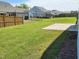 Generous backyard offering lots of green space and a concrete patio, perfect for entertaining or relaxation at 2432 Nassau Trce, Fuquay Varina, NC 27526