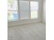 A bright bedroom featuring plush carpet and a large window at 2432 Nassau Trce, Fuquay Varina, NC 27526