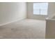 This spacious bedroom features neutral walls, plush carpet, and a window with natural light at 2432 Nassau Trce, Fuquay Varina, NC 27526
