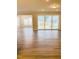 Inviting living area with sliding glass doors providing ample natural light and seamless access to the backyard at 2432 Nassau Trce, Fuquay Varina, NC 27526
