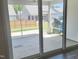 Sunroom featuring a patio with a screen, and view of a yard and surrounding houses at 2432 Nassau Trce, Fuquay Varina, NC 27526