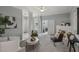 Comfortable living room with gray walls, carpet, ceiling fan, and an open view into office with sliding door at 2521 Friedland Pl # 303, Raleigh, NC 27617