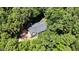 Aerial view of a home with mature trees at 26 Shadymont Dr, Pittsboro, NC 27312