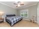 Comfortable bedroom features a ceiling fan and a large window for great natural light at 26 Shadymont Dr, Pittsboro, NC 27312