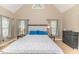 Cozy bedroom featuring neutral tones, vaulted ceiling, and multiple windows for natural light at 26 Shadymont Dr, Pittsboro, NC 27312