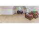 Spacious bonus room features a vaulted ceiling, cozy seating, and plush carpeting at 26 Shadymont Dr, Pittsboro, NC 27312