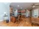 Lovely kitchen featuring hardwood floors, wood cabinets, granite counters, and stainless steel appliances at 26 Shadymont Dr, Pittsboro, NC 27312