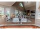 Close-up of the kitchen sink area featuring a granite countertop and view into the living room at 26 Shadymont Dr, Pittsboro, NC 27312