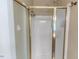 Bathroom features a walk-in shower with glass door and shower head at 26 Shadymont Dr, Pittsboro, NC 27312