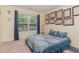 Comfortable bedroom featuring a large window for natural light and stylish blue bedding at 2810 Catamaunt, Durham, NC 27704