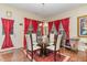 Stylish dining room featuring a glass table, seating for six, and hardwood floors at 2810 Catamaunt, Durham, NC 27704