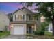 Charming two-story home with a well-maintained lawn and beautiful landscaping at 2810 Catamaunt, Durham, NC 27704