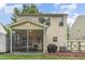 Back exterior view of home with screened-in porch, siding, and well-maintained yard at 2810 Catamaunt, Durham, NC 27704