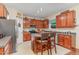 Well-equipped kitchen with stainless steel appliances, an island, and tile floors at 2810 Catamaunt, Durham, NC 27704