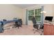 Functional office space with a large window, carpet, and a comfortable layout at 2810 Catamaunt, Durham, NC 27704