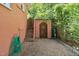 Backyard featuring gravel path leading to a wooden gate, along with a green garden hose at 309 E End Ave, Durham, NC 27703