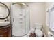 Bathroom featuring a stand up shower with glass doors, modern toilet and vanity with decorative mirror at 309 E End Ave, Durham, NC 27703