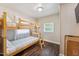 Bedroom featuring a wooden bunk bed and natural light at 309 E End Ave, Durham, NC 27703