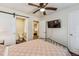Bedroom with a ceiling fan, ensuite bathroom, and mounted television at 309 E End Ave, Durham, NC 27703