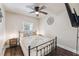 Cozy bedroom features a decorative ceiling fan and comfortable quilt bedding at 309 E End Ave, Durham, NC 27703