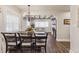 Charming dining area connecting to living space, featuring wood beam ceilings, stylish decor, and ample natural light at 309 E End Ave, Durham, NC 27703