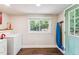 Bright laundry room with a window and access to the backyard at 309 E End Ave, Durham, NC 27703