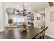 Open-concept space with a dining area that flows into the living room, featuring wood floors and beam ceilings at 309 E End Ave, Durham, NC 27703