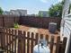 Fenced backyard with an air conditioner and a propane tank at 315 Sugarpine Trl, Clayton, NC 27520