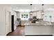 Modern kitchen with granite countertops, stainless steel appliances, subway tile backsplash and white cabinets at 315 Sugarpine Trl, Clayton, NC 27520