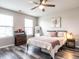 Cozy bedroom features a ceiling fan and a window providing natural light at 3441 Jordan Shires Dr, New Hill, NC 27562