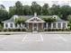 The community center boasts a welcoming entrance and reserved parking, set among mature trees at 3441 Jordan Shires Dr, New Hill, NC 27562