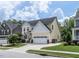 Charming two-story home with a two-car garage, landscaped yard, and a welcoming front porch at 3441 Jordan Shires Dr, New Hill, NC 27562