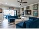 Stylish living room with modern furniture, unique artwork, and a ceiling fan at 3441 Jordan Shires Dr, New Hill, NC 27562