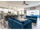 Spacious living room seamlessly transitions to the modern kitchen and dining area at 3441 Jordan Shires Dr, New Hill, NC 27562
