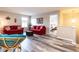 Open living area includes seating, entertainment, and a glimpse into the bedroom at 3441 Jordan Shires Dr, New Hill, NC 27562