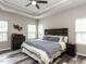 Serene bedroom with tray ceilings, natural light, and neutral decor at 3441 Jordan Shires Dr, New Hill, NC 27562