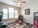 Home office with natural light, plush chair, and wood floors at 3441 Jordan Shires Dr, New Hill, NC 27562
