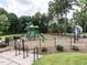 A fenced playground area with slides and play equipment provides a safe and fun environment at 3441 Jordan Shires Dr, New Hill, NC 27562